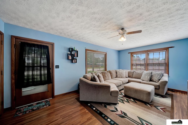 4415 S St, Lincoln, NE 68506 - living area with wood finished floors, ceiling fan, and a textured ceiling