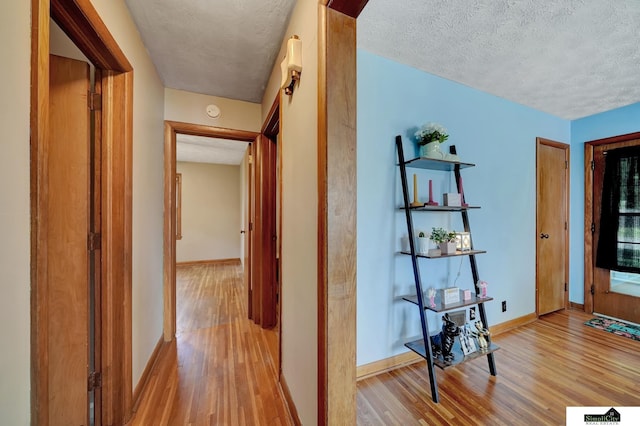 4415 S St, Lincoln, NE 68506 - hall with wood finished floors and a textured ceiling