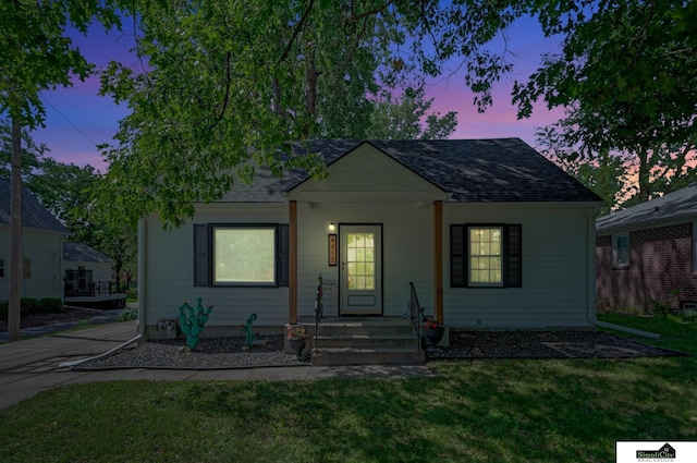 4415 S St, Lincoln, NE 68506 - bungalow-style house with a shingled roof and a front yard