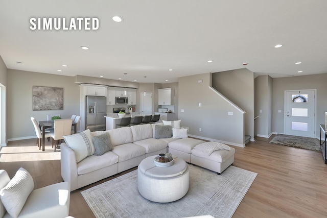 246 N 105th St, Lincoln, NE 68527 - living area with recessed lighting and light wood-style floors