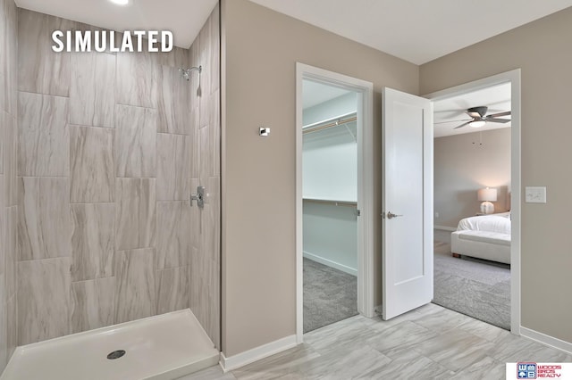 246 N 105th St, Lincoln, NE 68527 - full bath with tiled shower, ensuite bathroom, ceiling fan, and a walk in closet