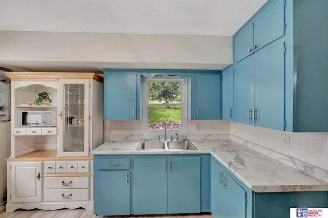 6336 N 37th St, Omaha, NE 68111 - kitchen with blue cabinetry and light countertops