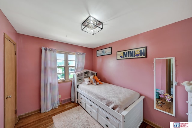 6336 N 37th St, Omaha, NE 68111 - bedroom with wood finished floors and baseboards