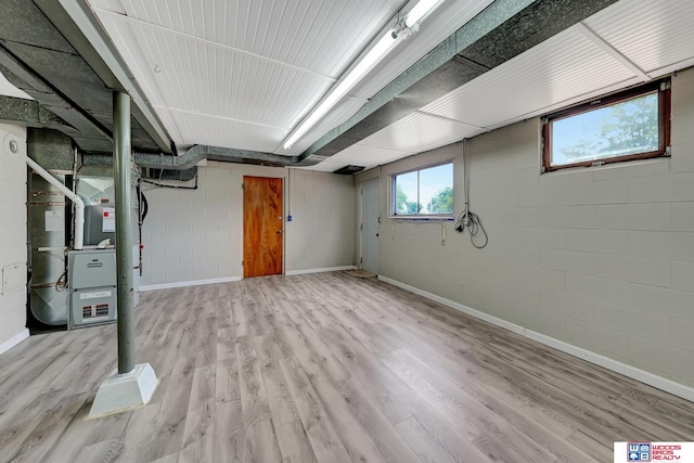 6336 N 37th St, Omaha, NE 68111 - basement with wood finished floors, concrete block wall, and heating unit