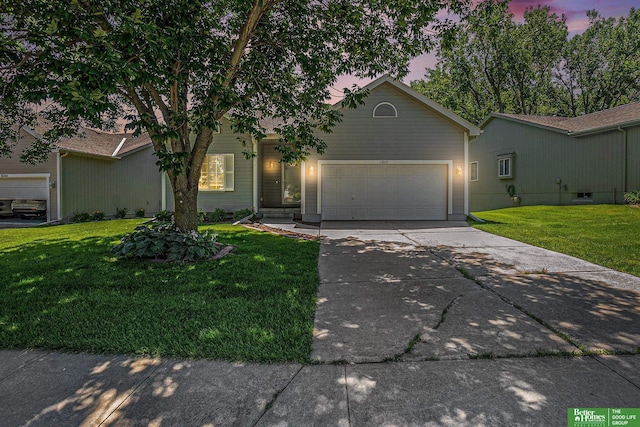 15209 Saratoga St, Omaha, NE 68116 - ranch-style house with concrete driveway, an attached garage, and a lawn
