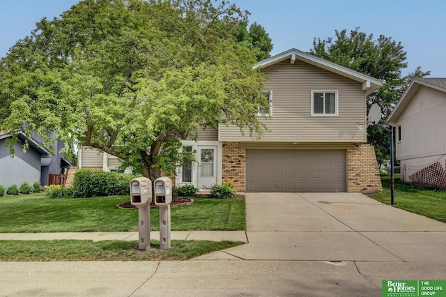 11122 Jefferson St, Omaha, NE 68137 - view of front of property with brick siding, an attached garage, a front yard, and concrete driveway