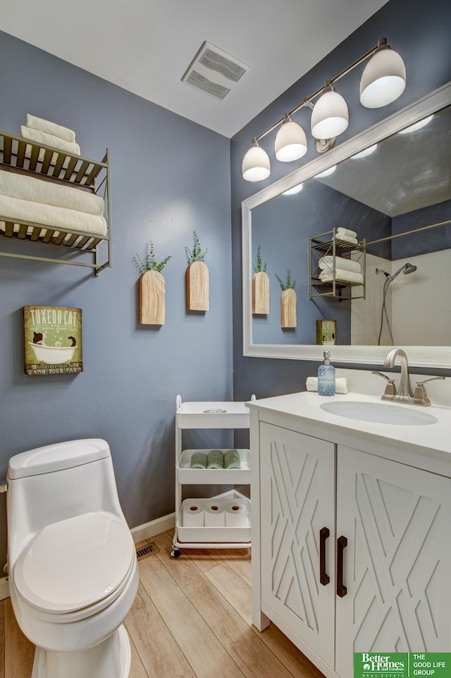 11122 Jefferson St, Omaha, NE 68137 - full bathroom with wood finished floors, vanity, and a shower