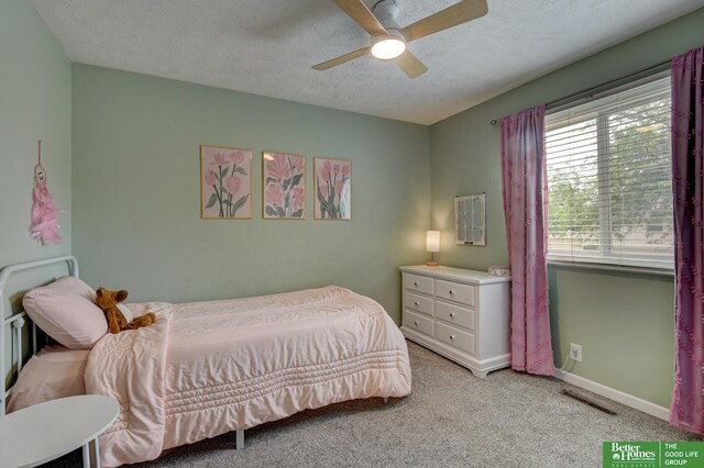 11122 Jefferson St, Omaha, NE 68137 - bedroom featuring light colored carpet, a textured ceiling, and ceiling fan