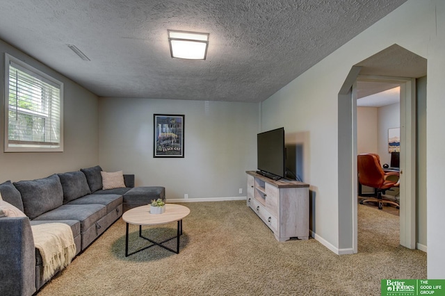 11122 Jefferson St, Omaha, NE 68137 - carpeted living area with a textured ceiling and arched walkways