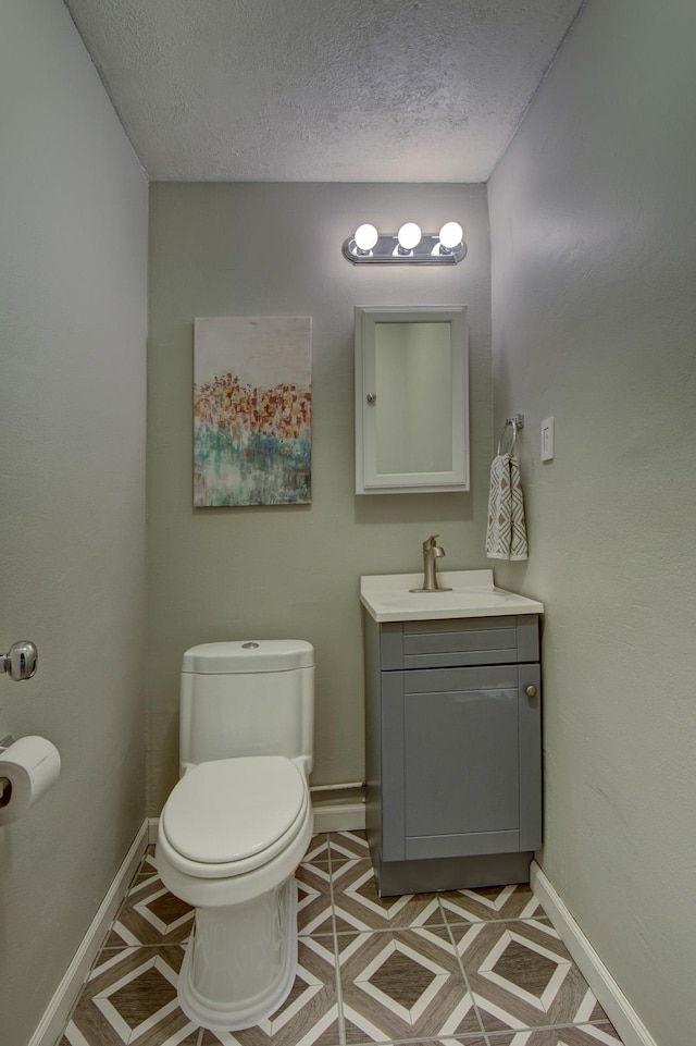 11122 Jefferson St, Omaha, NE 68137 - half bathroom featuring vanity and a textured ceiling