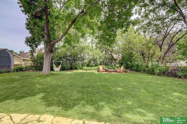 11122 Jefferson St, Omaha, NE 68137 - view of yard featuring an outdoor fire pit