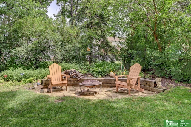 11122 Jefferson St, Omaha, NE 68137 - view of green lawn featuring an outdoor fire pit and a patio area