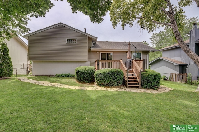 11122 Jefferson St, Omaha, NE 68137 - rear view of property featuring a fenced backyard, a deck, and roof with shingles