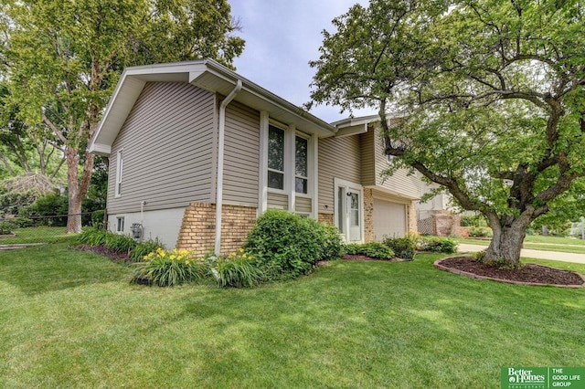 11122 Jefferson St, Omaha, NE 68137 - view of front facade featuring brick siding and an attached garage