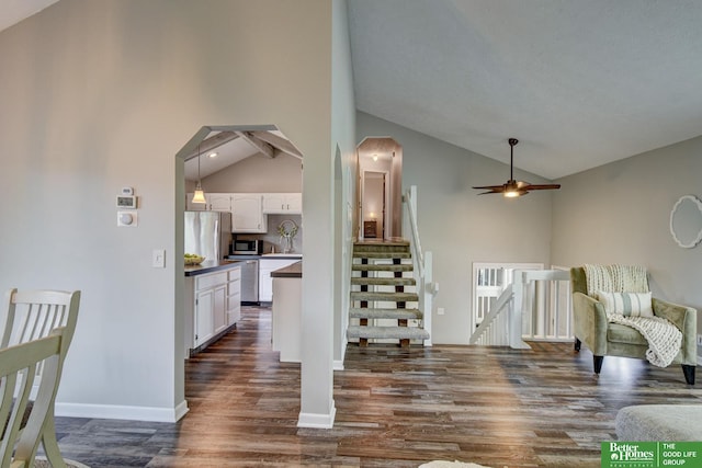 11122 Jefferson St, Omaha, NE 68137 - living area featuring vaulted ceiling, dark wood-style floors, and ceiling fan