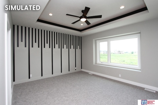 941 N 104th St, Lincoln, NE 68527 - empty room with a tray ceiling, recessed lighting, a ceiling fan, and carpet