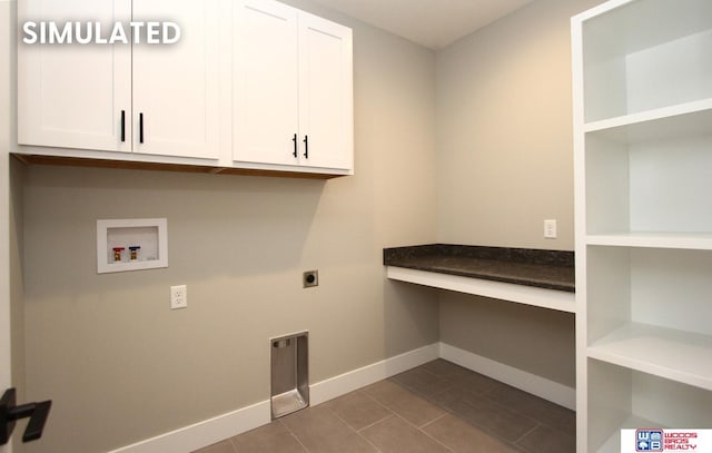 941 N 104th St, Lincoln, NE 68527 - washroom with cabinet space, washer hookup, hookup for an electric dryer, and dark tile patterned flooring