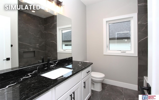 941 N 104th St, Lincoln, NE 68527 - bathroom with marble look tile flooring and vanity