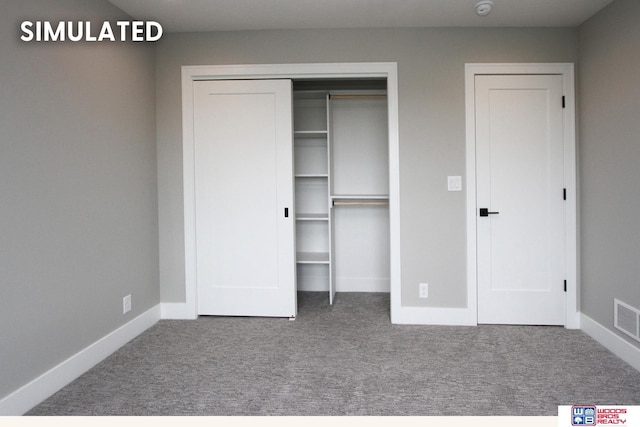 941 N 104th St, Lincoln, NE 68527 - unfurnished bedroom featuring carpet floors and a closet