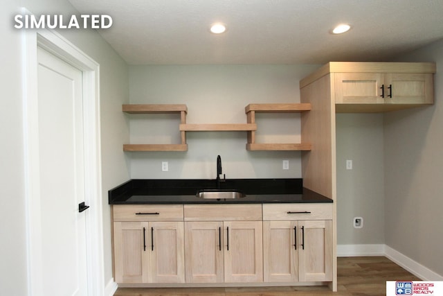 941 N 104th St, Lincoln, NE 68527 - kitchen featuring wood finished floors, open shelves, dark countertops, light brown cabinetry, and recessed lighting