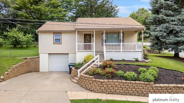 3052 S 46th Ave, Omaha, NE 68106 - ranch-style home with covered porch, concrete driveway, an attached garage, and a shingled roof