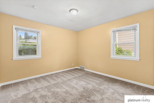 3052 S 46th Ave, Omaha, NE 68106 - spare room featuring carpet flooring and a smoke detector