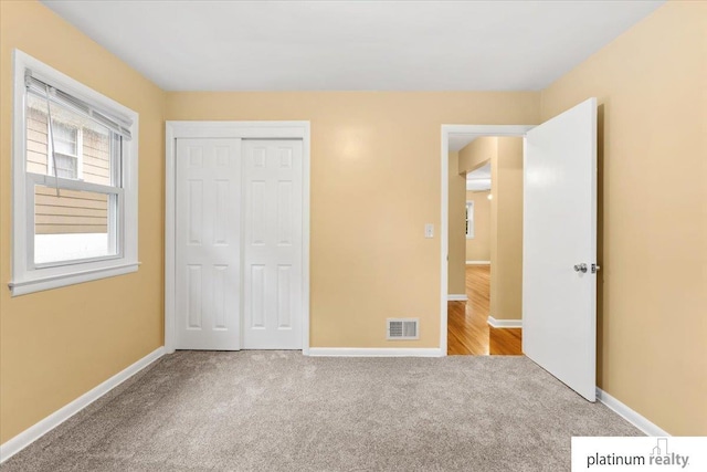 3052 S 46th Ave, Omaha, NE 68106 - unfurnished bedroom featuring carpet flooring and a closet