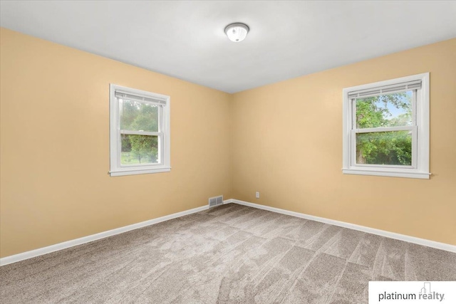 3052 S 46th Ave, Omaha, NE 68106 - carpeted empty room with healthy amount of natural light