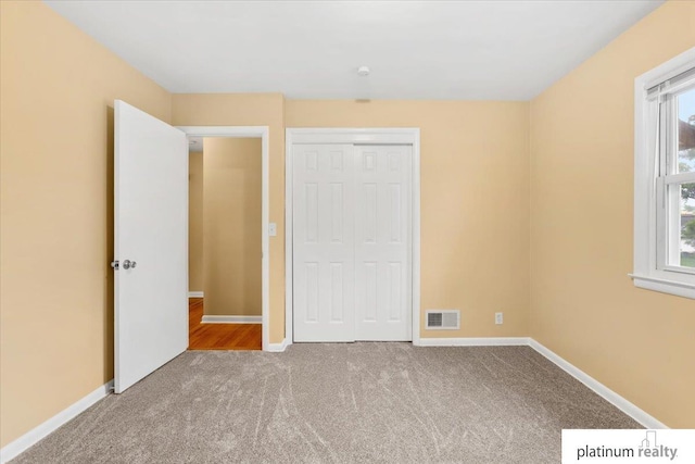 3052 S 46th Ave, Omaha, NE 68106 - unfurnished bedroom featuring carpet flooring and a closet
