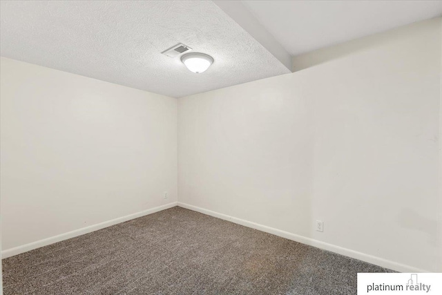 3052 S 46th Ave, Omaha, NE 68106 - carpeted spare room featuring baseboards and a textured ceiling