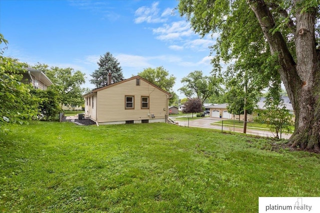 3052 S 46th Ave, Omaha, NE 68106 - view of side of home featuring a lawn