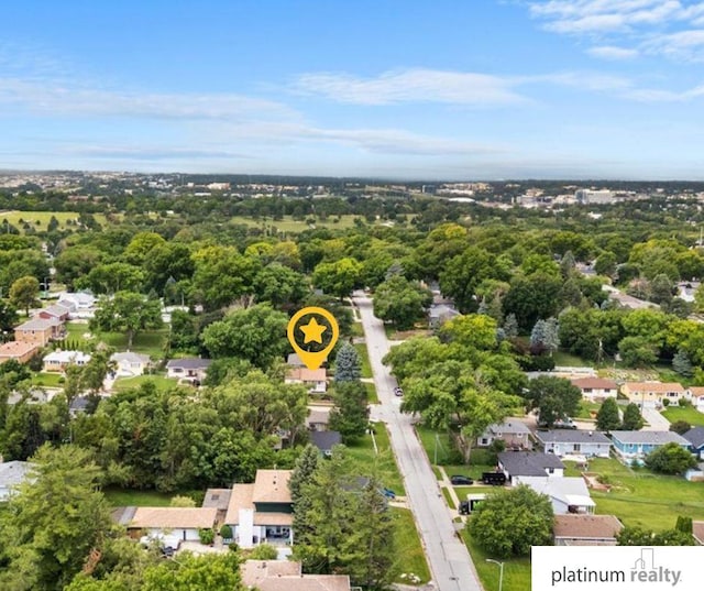 3052 S 46th Ave, Omaha, NE 68106 - aerial perspective of suburban area featuring a tree filled landscape