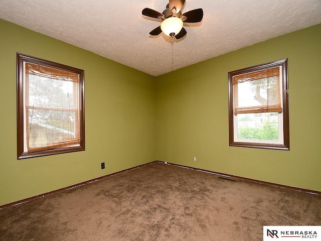 7626 S 41st St, Bellevue, NE 68147 - unfurnished room featuring dark colored carpet and a textured ceiling