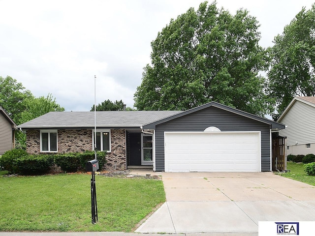 1312 N 148th Plz, Omaha, NE 68154 - ranch-style house with a garage, driveway, brick siding, and a front lawn