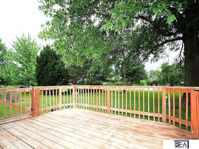 1312 N 148th Plz, Omaha, NE 68154 - wooden deck with a lawn and view of scattered trees