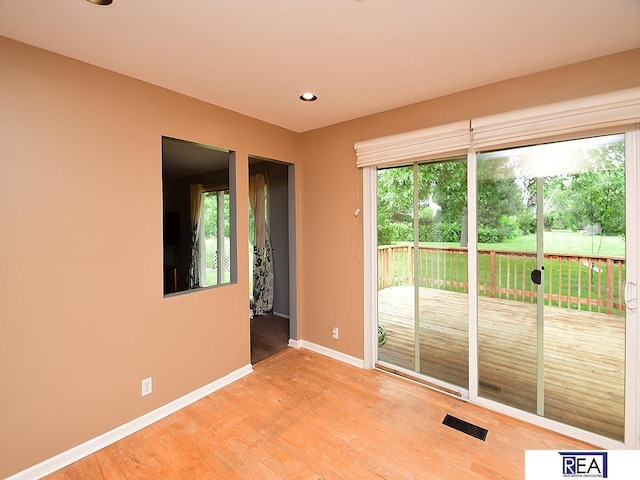 1312 N 148th Plz, Omaha, NE 68154 - spare room featuring light wood-style floors and recessed lighting