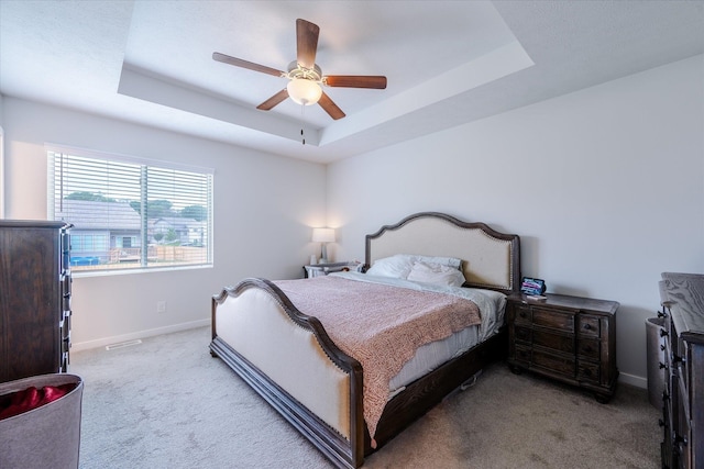 7794 N 88th St, Omaha, NE 68122 - carpeted bedroom featuring a tray ceiling and ceiling fan