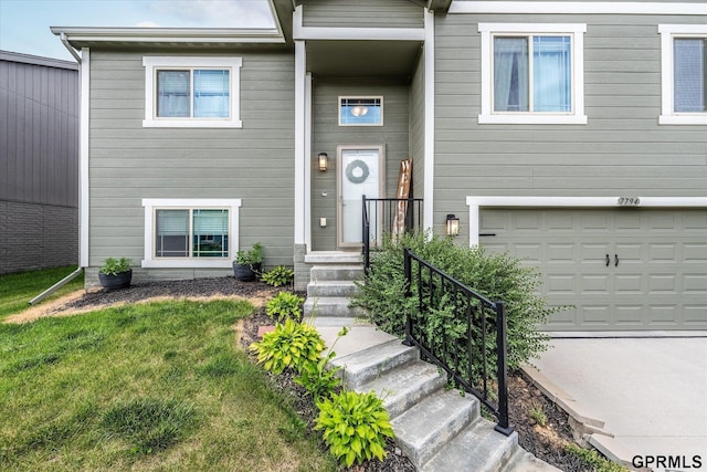 7794 N 88th St, Omaha, NE 68122 - view of front of property with an attached garage and a front lawn