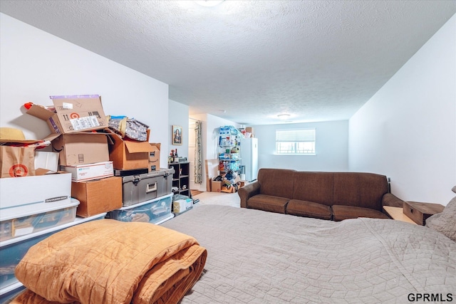 7794 N 88th St, Omaha, NE 68122 - bedroom with a textured ceiling and freestanding refrigerator