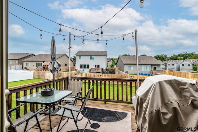 7794 N 88th St, Omaha, NE 68122 - wooden terrace with a residential view, a grill, outdoor dining space, and a fenced backyard