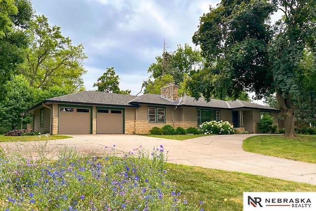 437 S 90th St, Omaha, NE 68114 - single story home featuring a garage, driveway, a front yard, a chimney, and stone siding