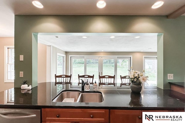 437 S 90th St, Omaha, NE 68114 - kitchen with dishwasher, recessed lighting, brown cabinets, and dark stone countertops
