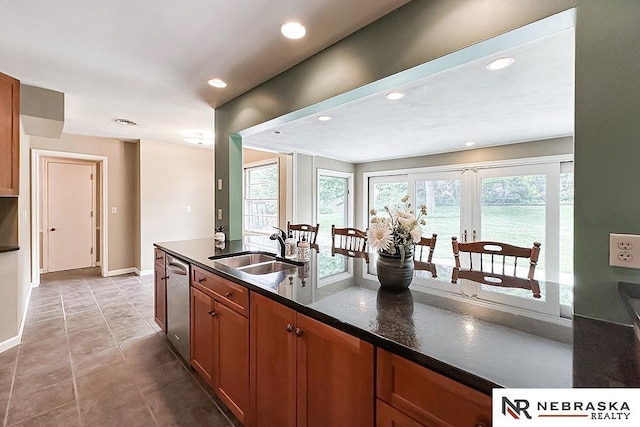 437 S 90th St, Omaha, NE 68114 - kitchen with dishwasher, recessed lighting, brown cabinets, and dark stone counters