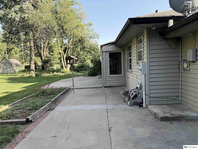 437 S 90th St, Omaha, NE 68114 - view of side of property with a patio area and a lawn