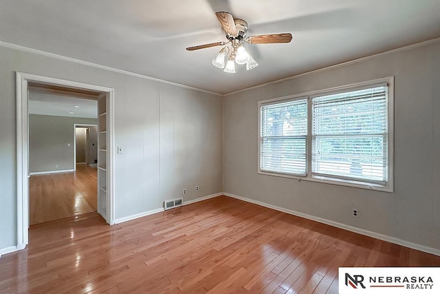 437 S 90th St, Omaha, NE 68114 - spare room with light wood finished floors, crown molding, and a ceiling fan