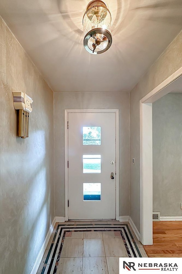 437 S 90th St, Omaha, NE 68114 - entrance foyer with baseboards and a chandelier