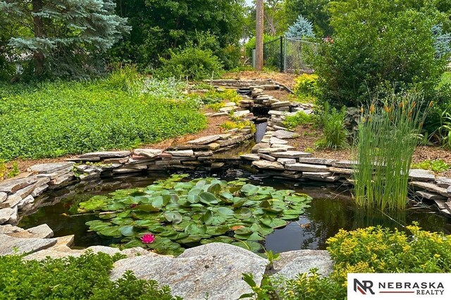 437 S 90th St, Omaha, NE 68114 - view of yard with a garden pond