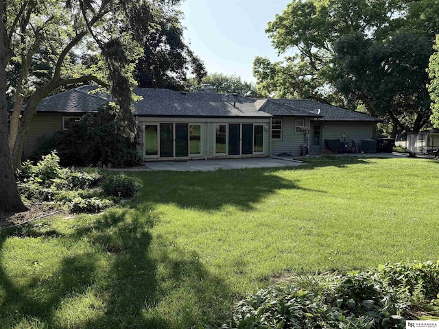 437 S 90th St, Omaha, NE 68114 - rear view of house featuring a patio, a yard, and roof with shingles