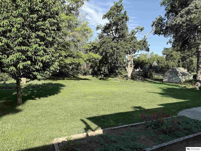 437 S 90th St, Omaha, NE 68114 - view of grassy yard featuring a storage unit