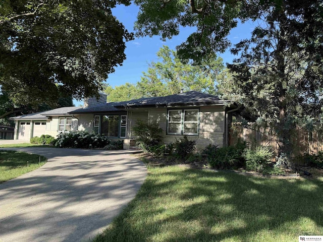 437 S 90th St, Omaha, NE 68114 - ranch-style home featuring an attached garage, a front yard, a chimney, and driveway